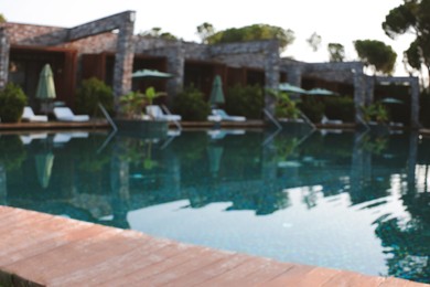 Outdoor swimming pool at resort, blurred view