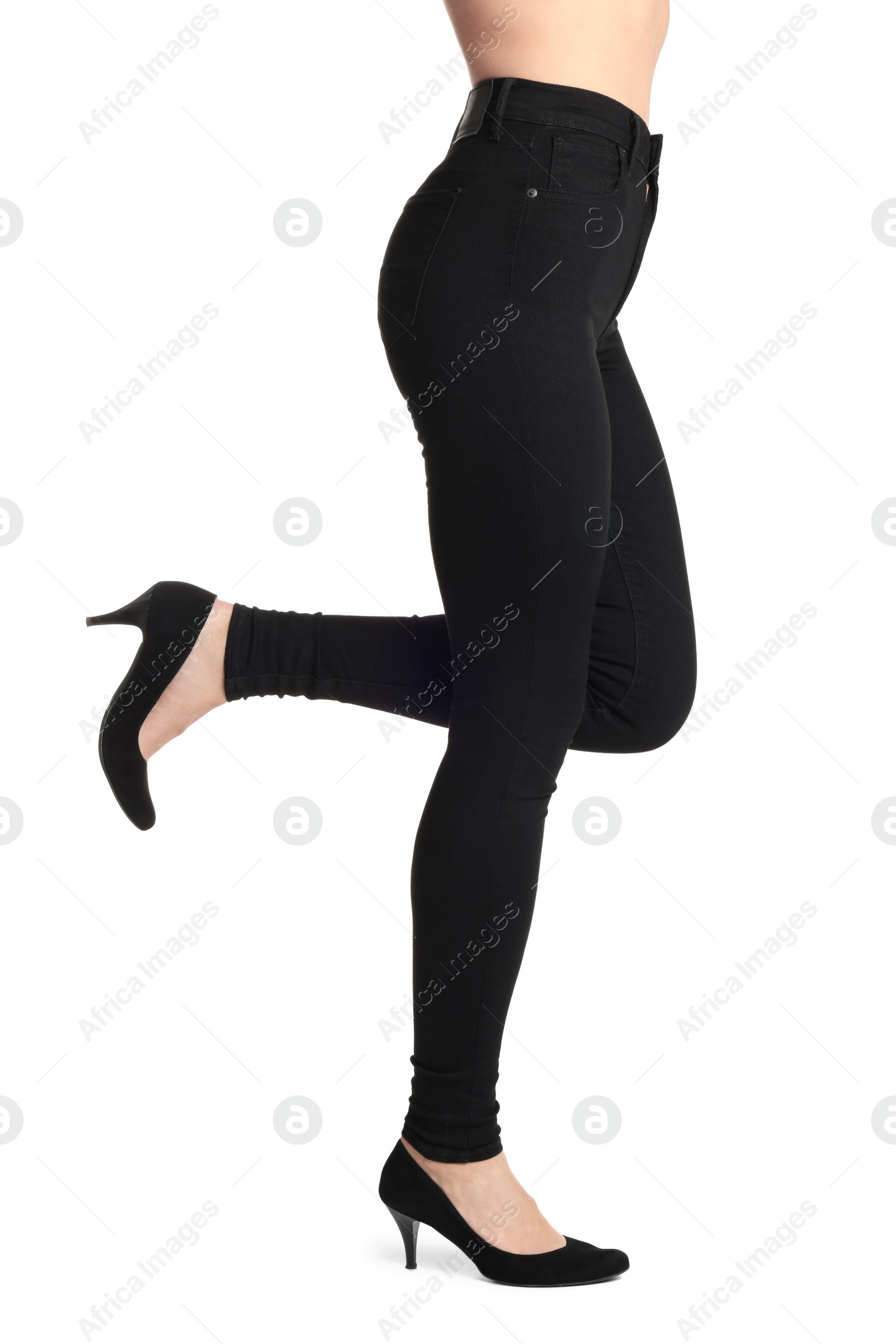 Photo of Woman wearing stylish black jeans and high heels shoes on white background, closeup