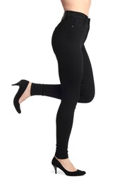 Woman wearing stylish black jeans and high heels shoes on white background, closeup