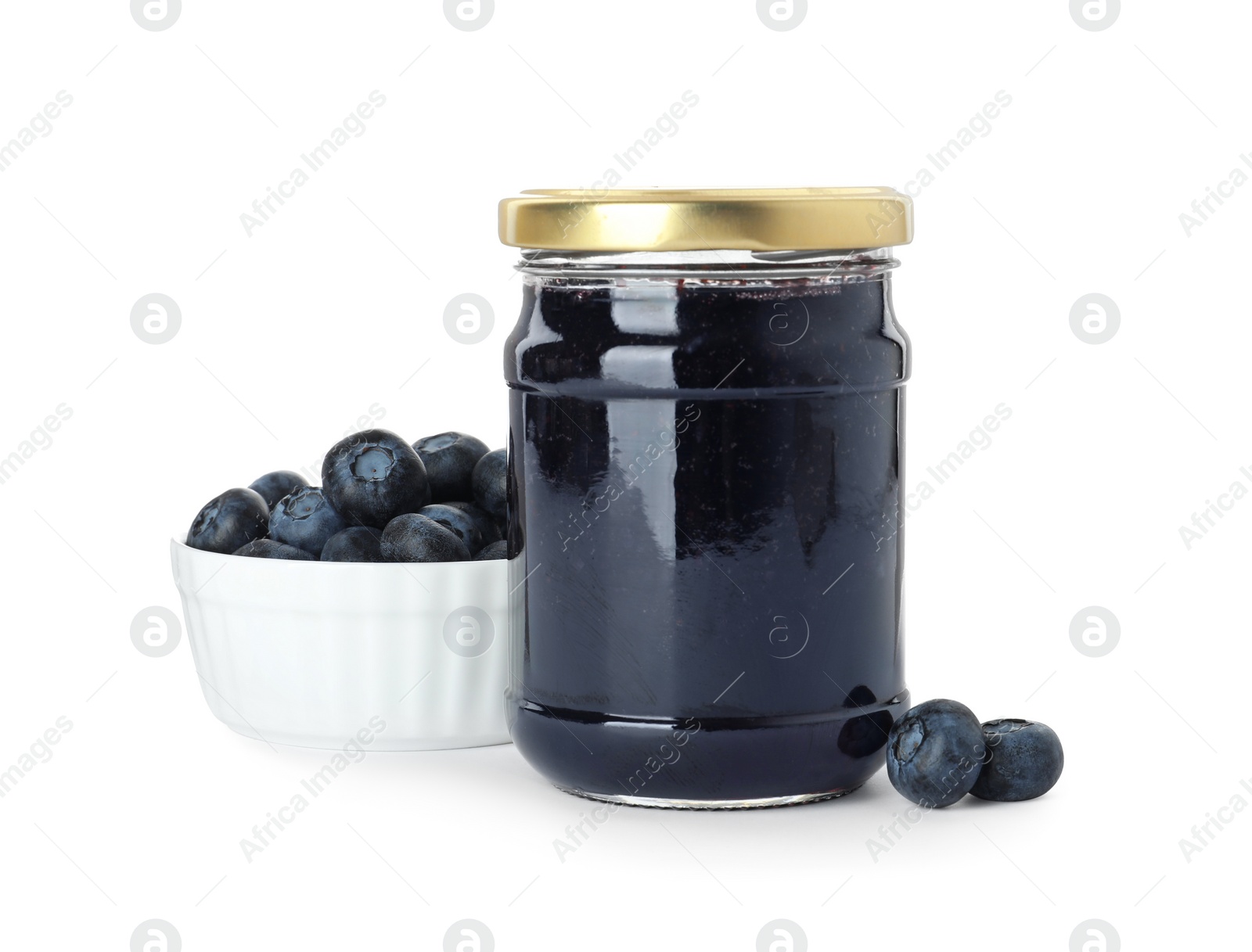 Photo of Jar of blueberry jam and fresh berries on white background