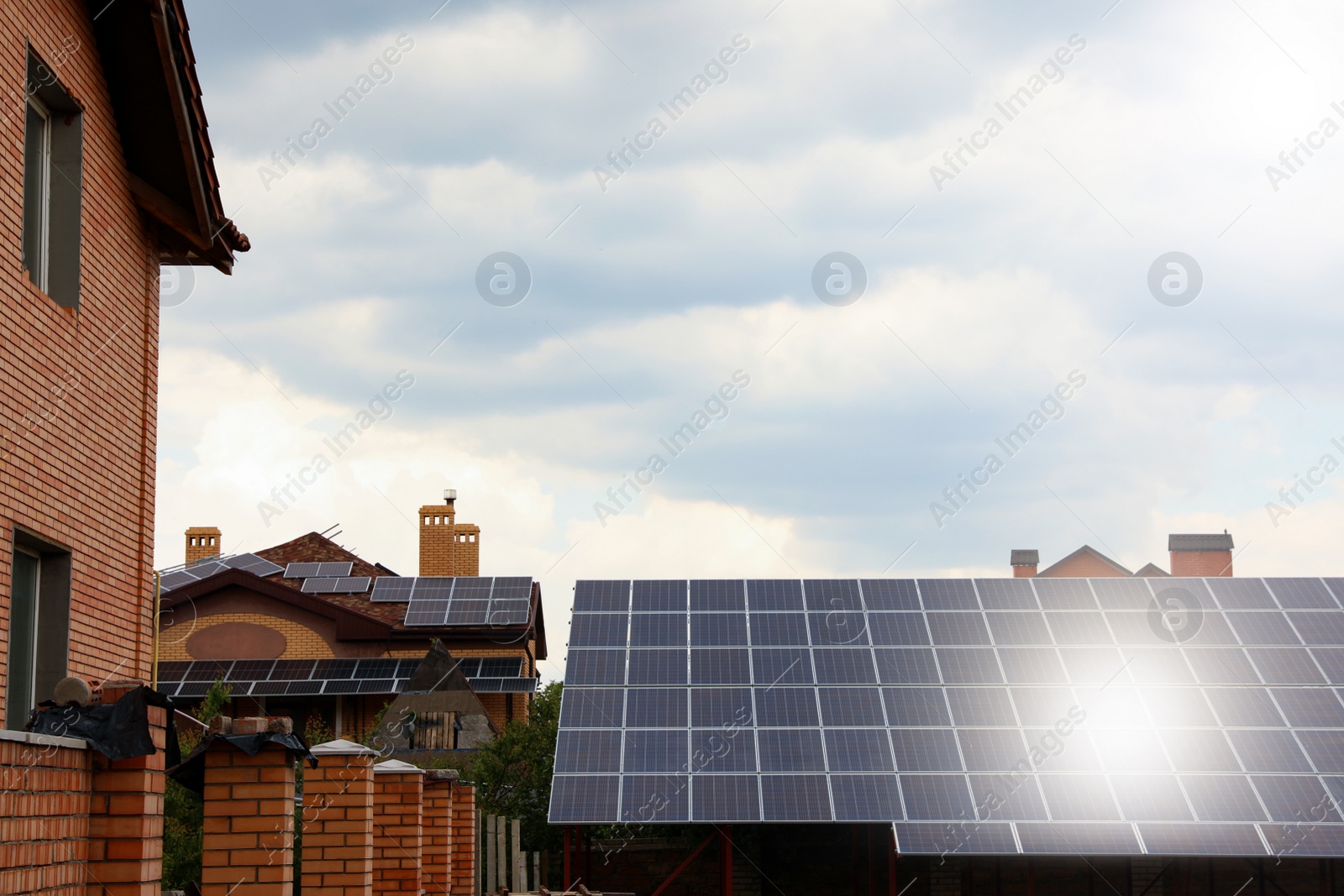 Photo of Building with installed solar panels on roof. Alternative energy source