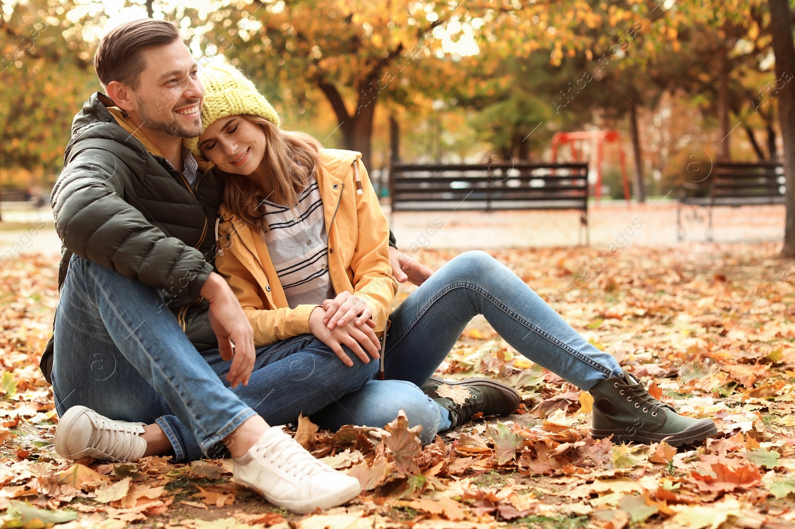 Photo of Lovely couple spending time together in park. Autumn walk