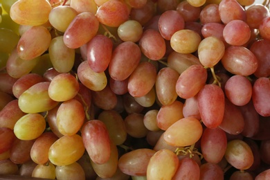 Fresh ripe juicy grapes as background, closeup view