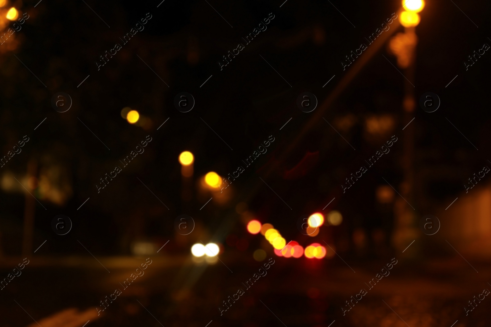 Photo of Blurred view of night cityscape with bokeh effect