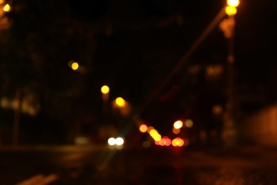 Photo of Blurred view of night cityscape with bokeh effect