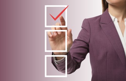 Woman pointing at check mark in box on virtual screen, closeup