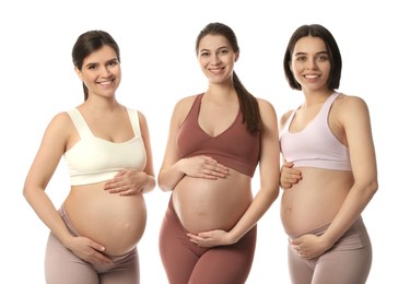 Photo of Happy young pregnant women on white background