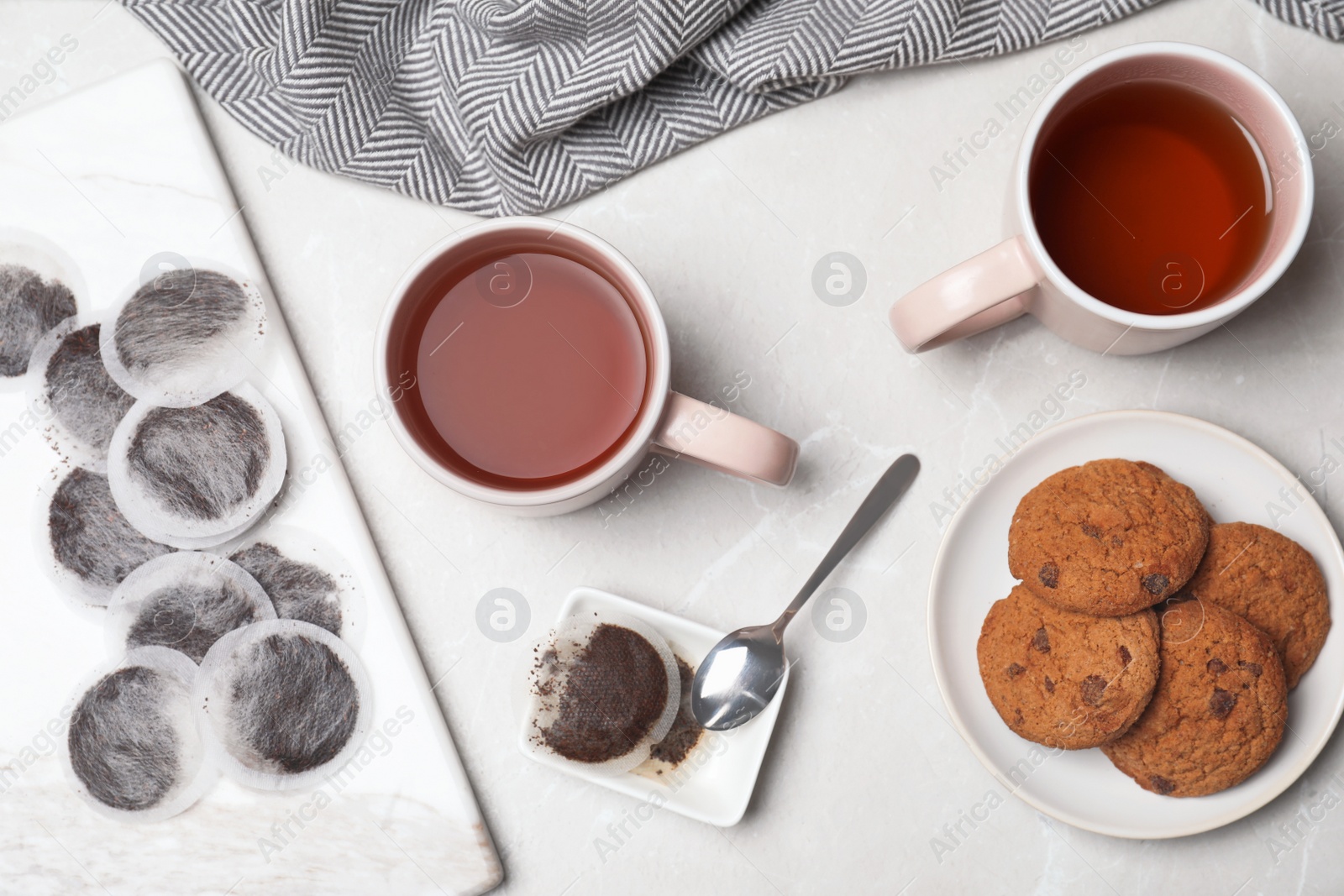 Photo of Flat lay composition with fresh tea and cookies on table