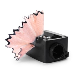 Photo of Black sharpener with pencil shavings on white background