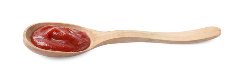 Photo of Ketchup in wooden spoon isolated on white