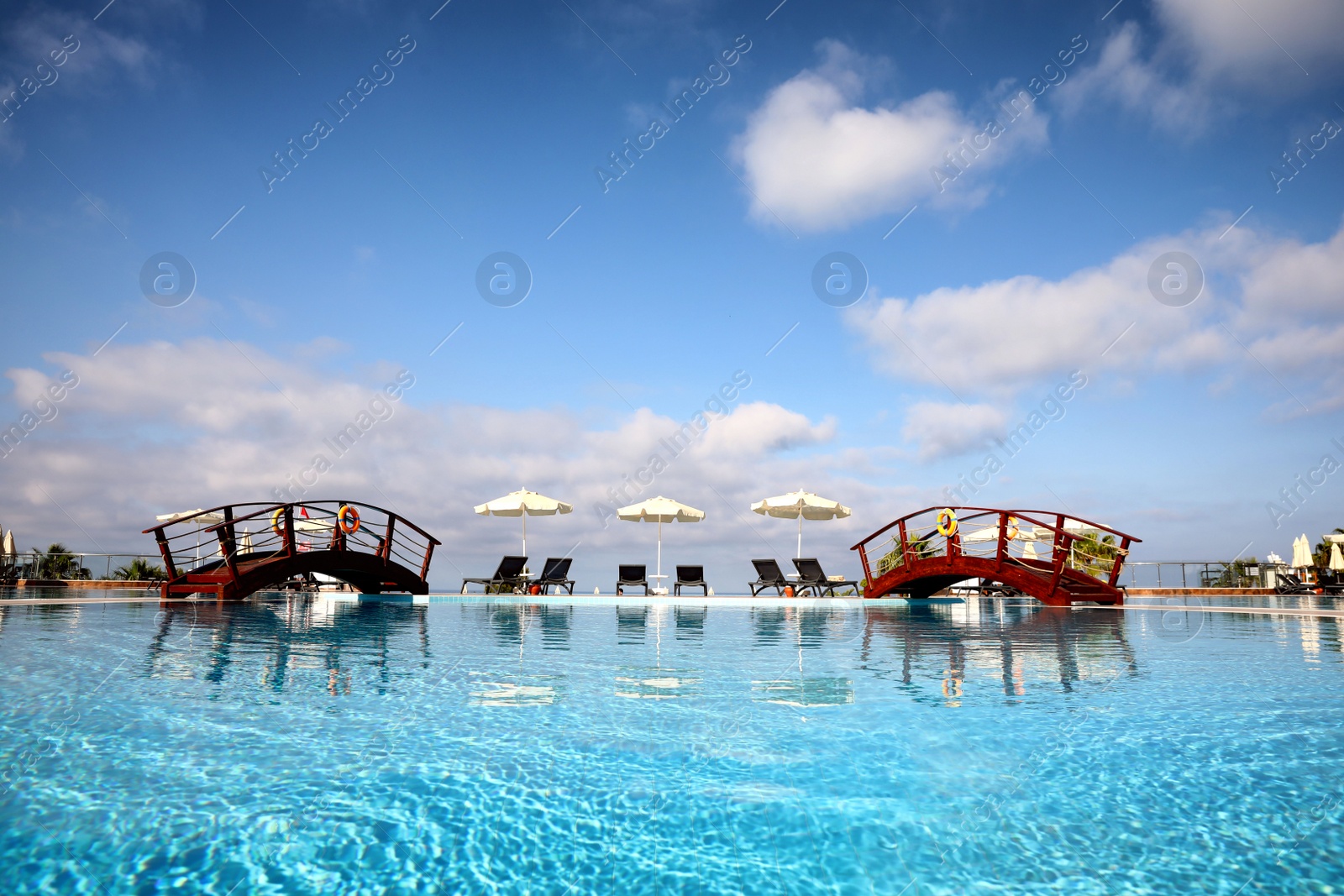 Photo of Beautiful landscape with blue sky and swimming pool at resort