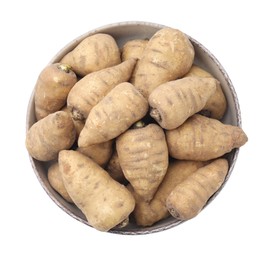 Photo of Tubers of turnip rooted chervil in bowl isolated on white, top view