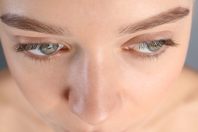 Photo of Young woman with beautiful natural eyelashes, closeup