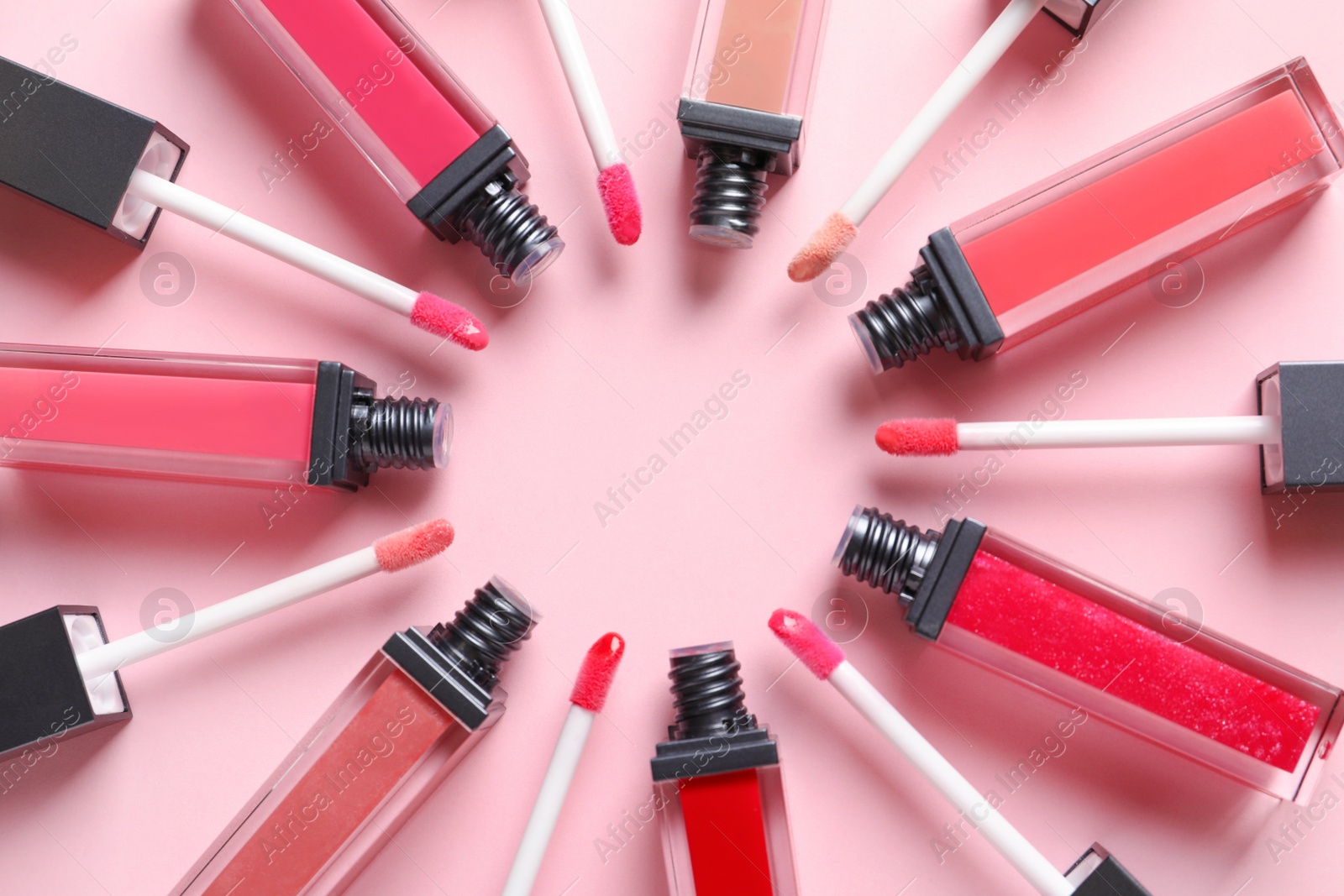 Photo of Composition of lipsticks on color background, flat lay.