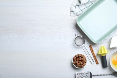 Photo of Cooking utensils and ingredients on white wooden table, flat lay. Space for text