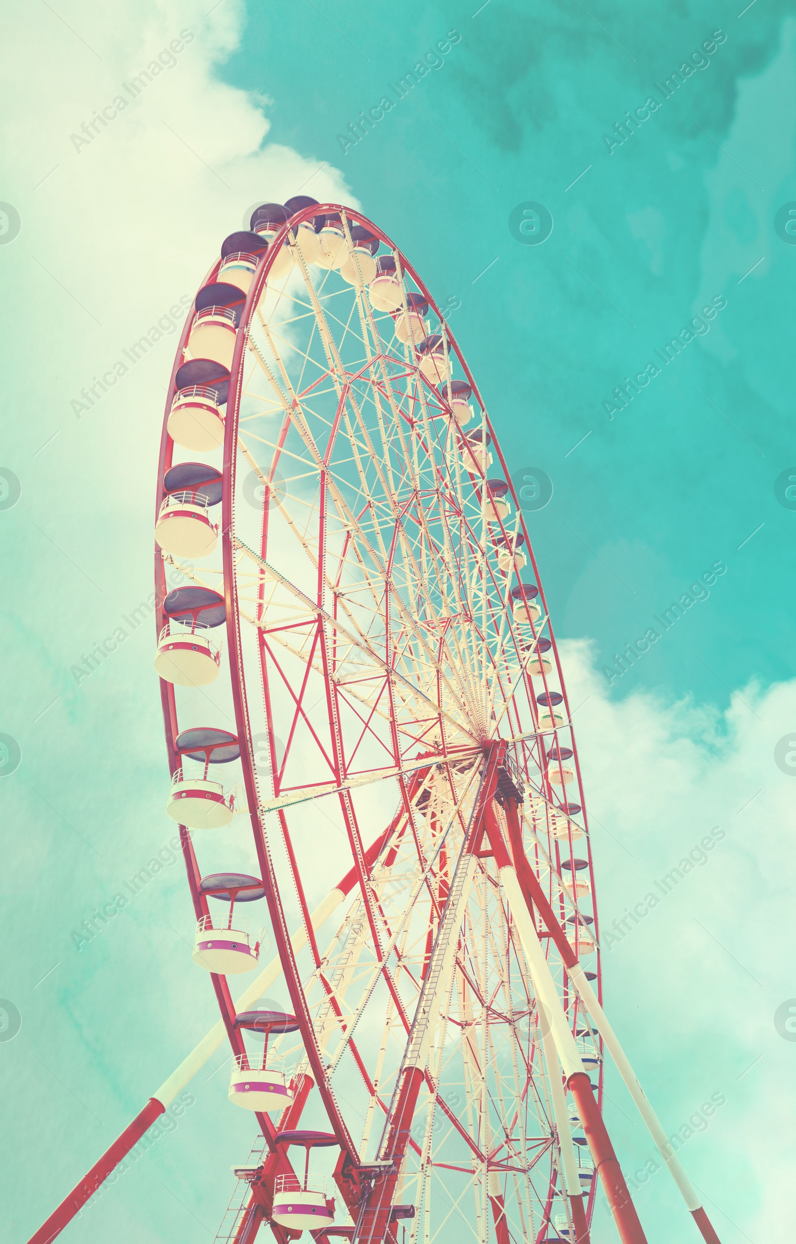 Image of Beautiful large Ferris wheel outdoors, low angle view