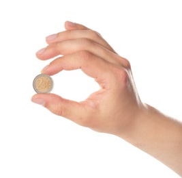 Man holding coin in hand on white background, closeup