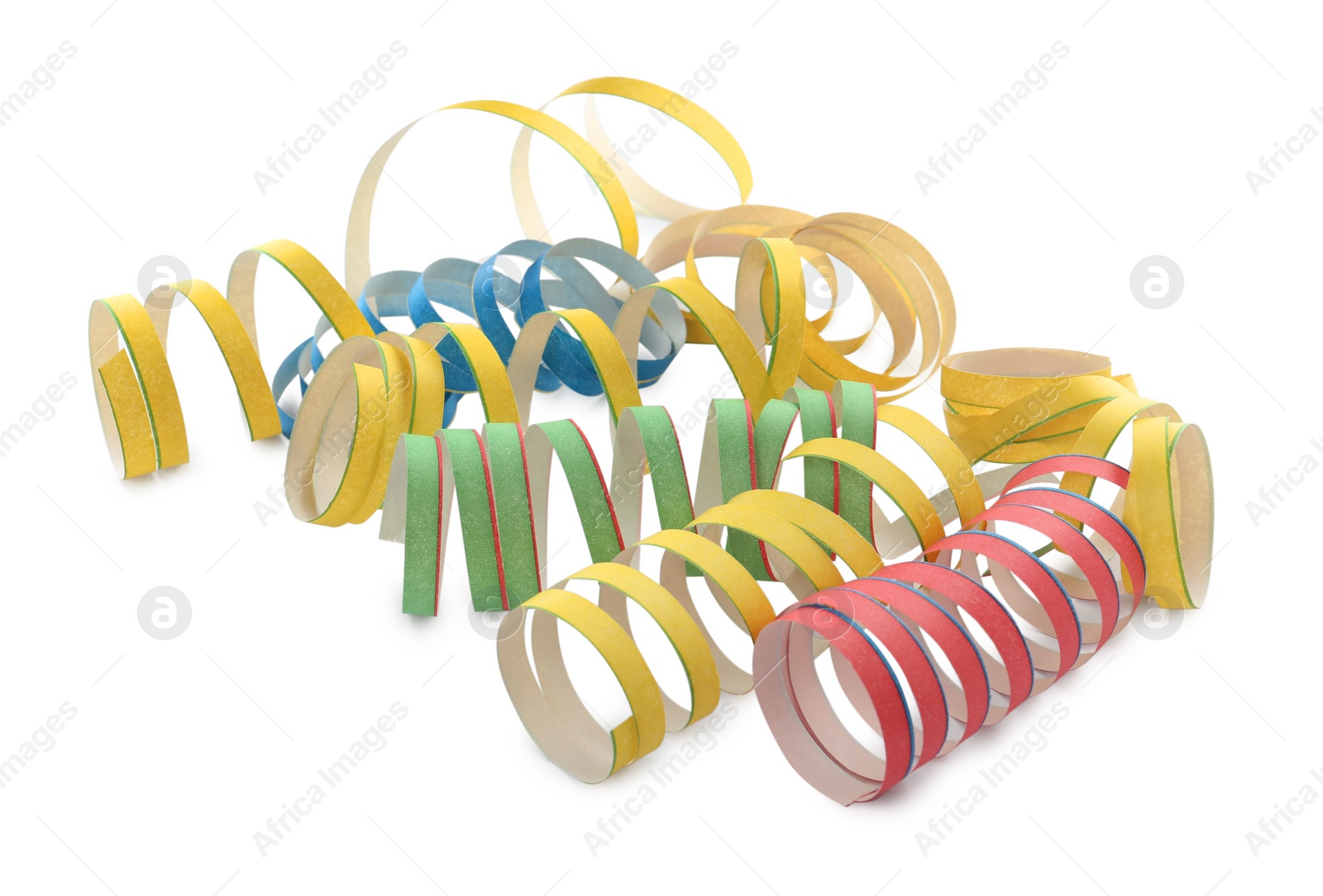 Photo of Colorful serpentine streamers on white background. Festive decor