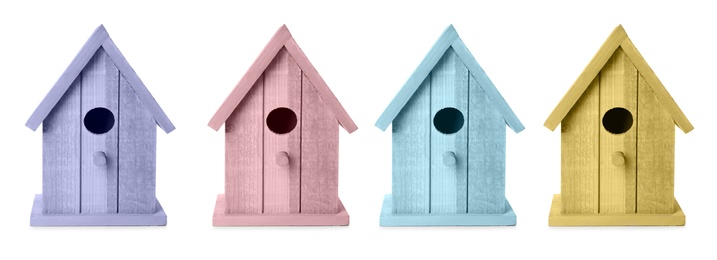 Image of Set with different colorful bird houses on white background, banner design 