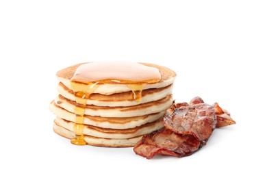 Photo of Delicious pancakes with maple syrup and fried bacon on white background