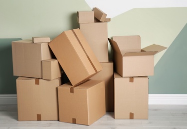 Photo of Cardboard boxes on floor indoors