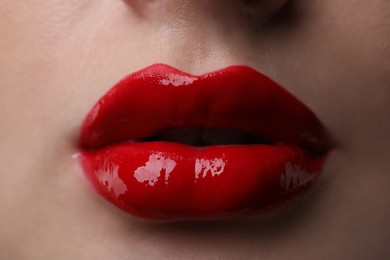 Photo of Young woman with perfect lips makeup, closeup