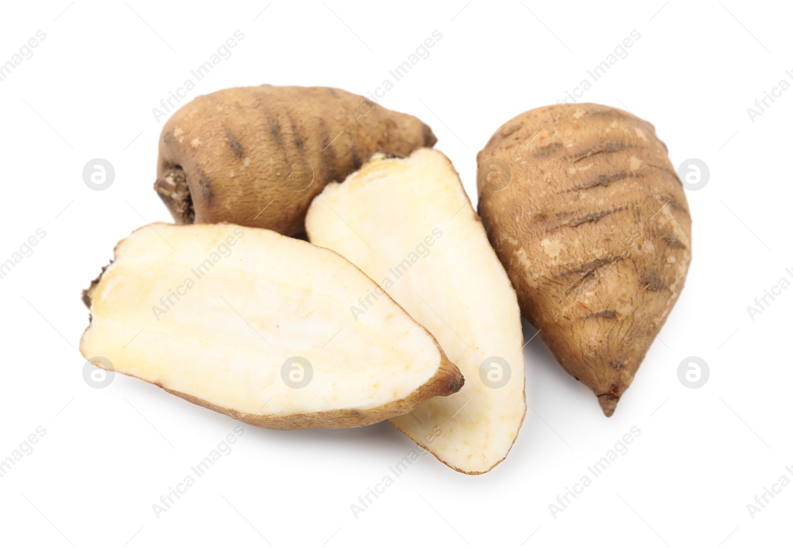 Photo of Whole and cut tubers of turnip rooted chervil isolated on white