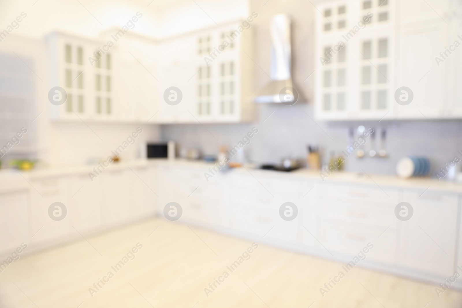 Photo of Blurred view of modern kitchen. Interior design