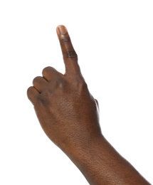 African-American man pointing at something on white background, closeup