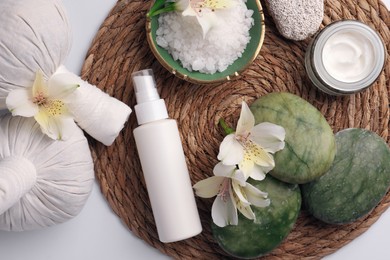 Photo of Flat lay composition with different spa products and beautiful flowers on white table