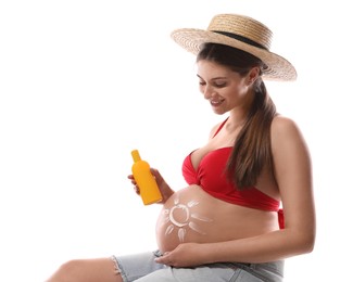 Photo of Young pregnant woman with sun protection cream on white background