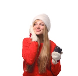 Photo of Portrait of young woman in stylish hat and sweater with paper coffee cup on white background. Winter atmosphere