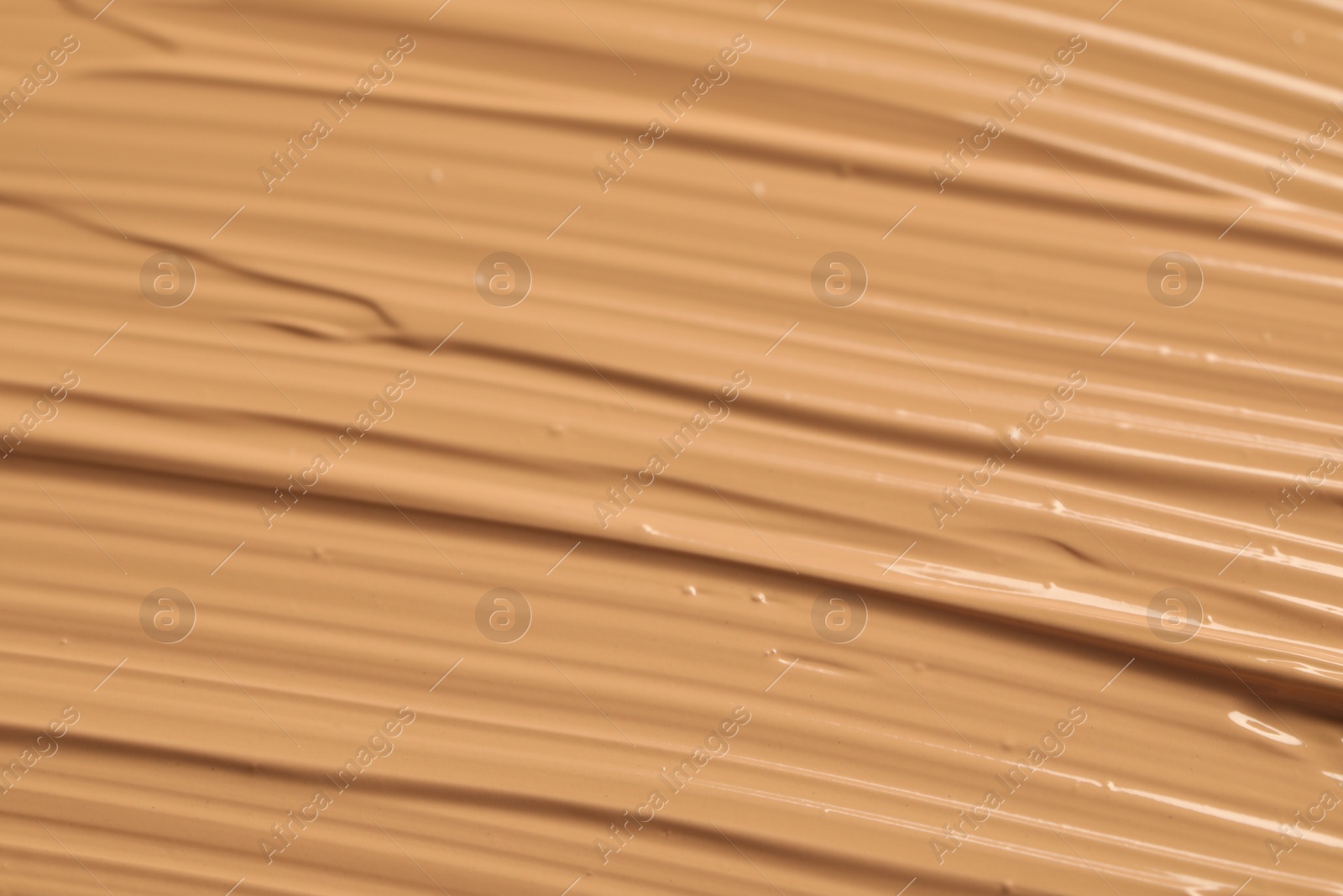 Photo of Texture of liquid skin foundation as background, closeup