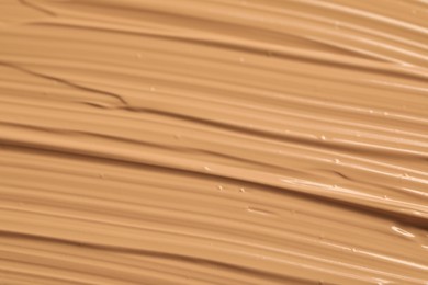 Photo of Texture of liquid skin foundation as background, closeup