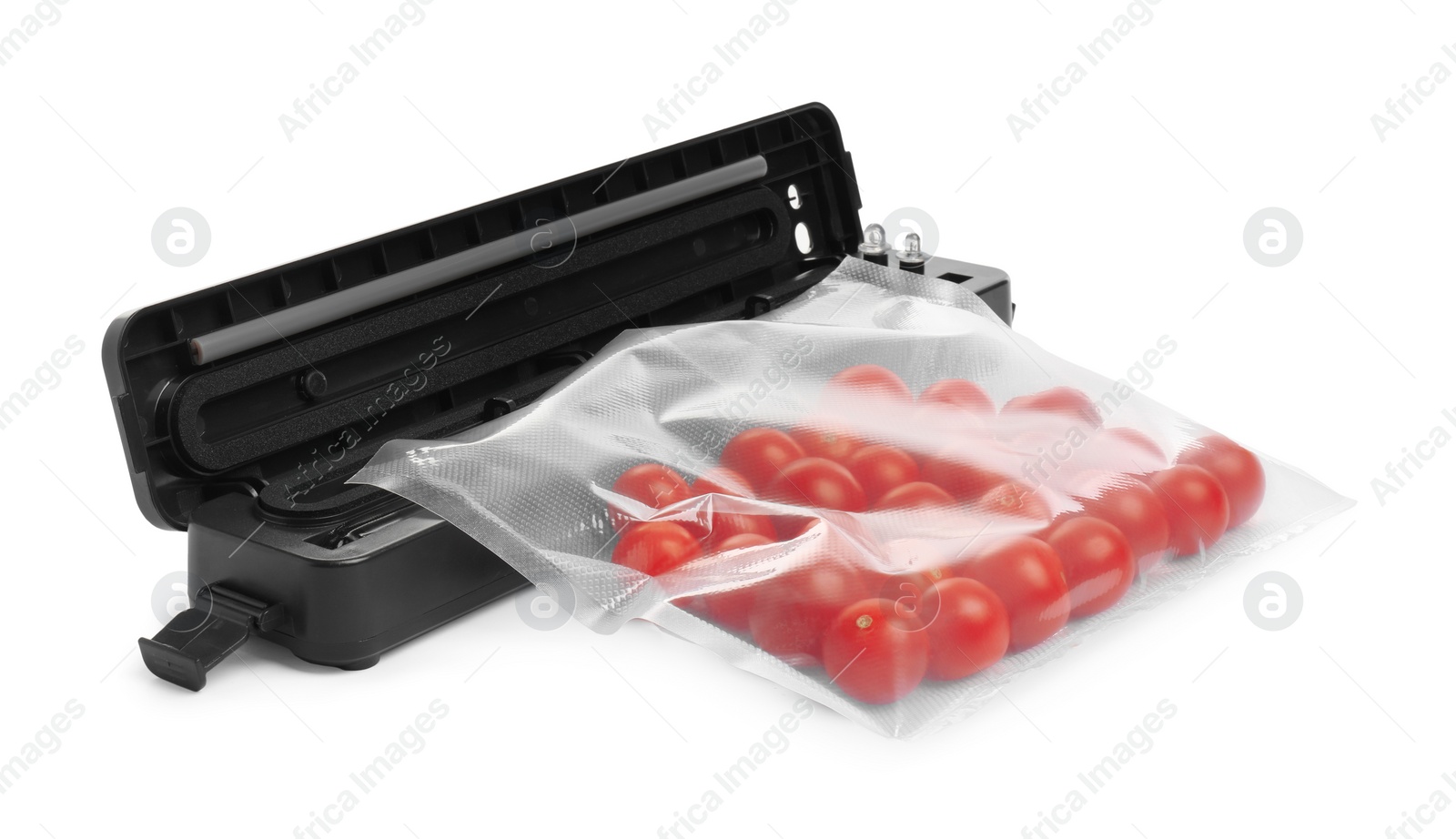 Photo of Sealer for vacuum packing with plastic bag of cherry tomatoes on white background