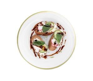 Delicious bruschettas with cream cheese, vegetables and balsamic vinegar isolated on white, top view