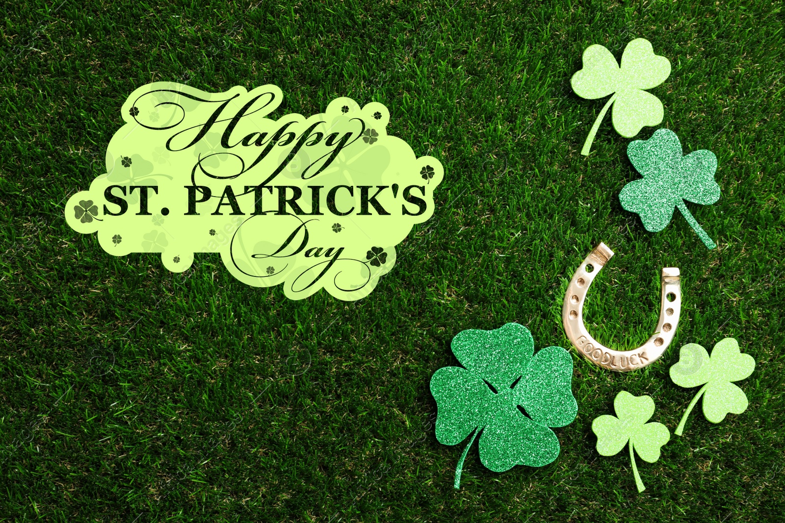 Image of Flat lay composition with horseshoe on green grass. St. Patrick's Day celebration