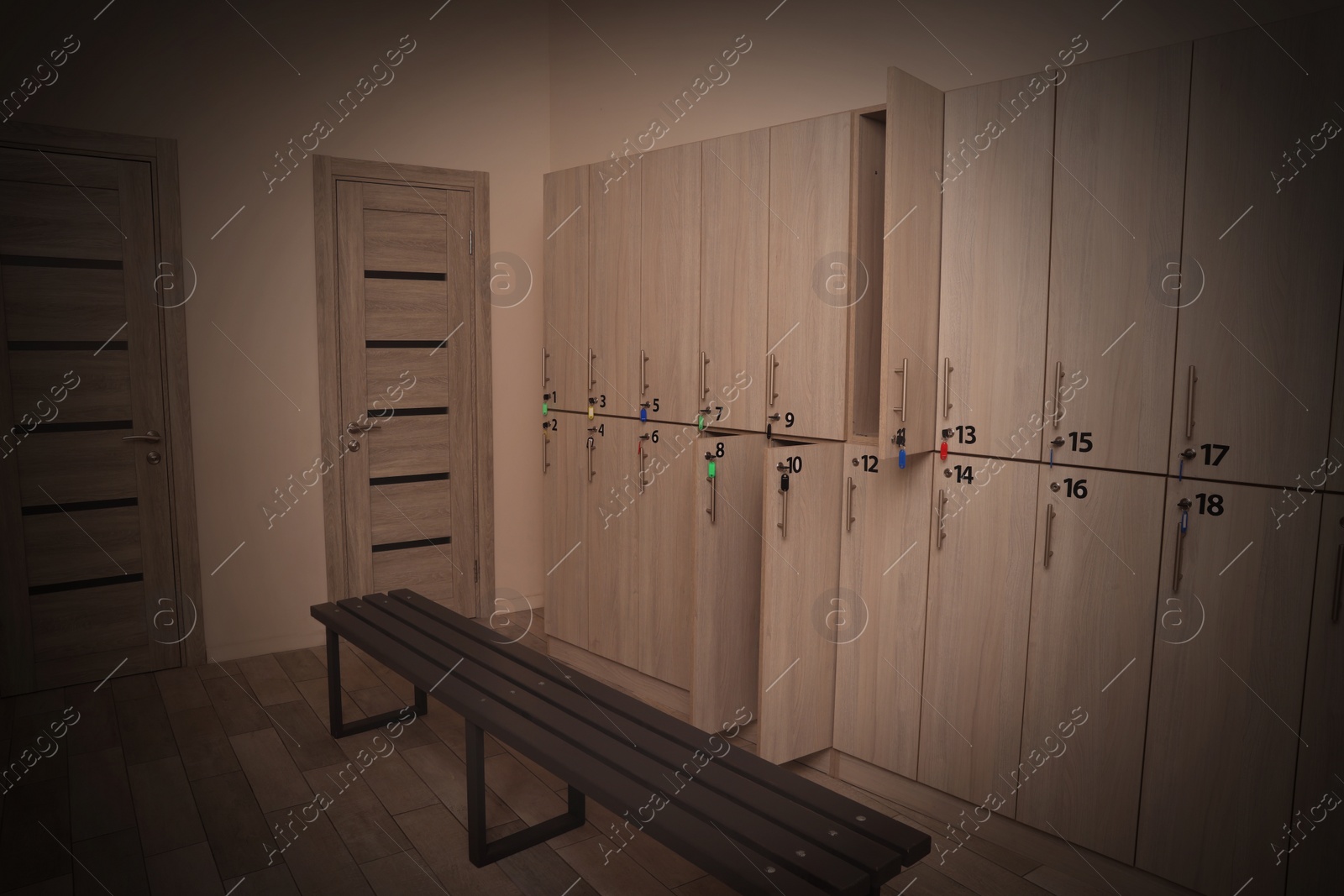 Image of Wooden bench and lockers in changing room interior. Vignette effect