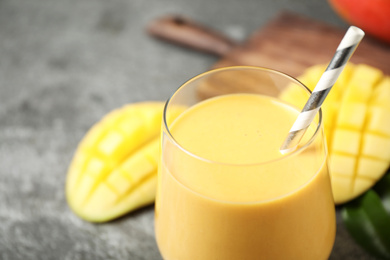 Fresh delicious mango drink on table, closeup