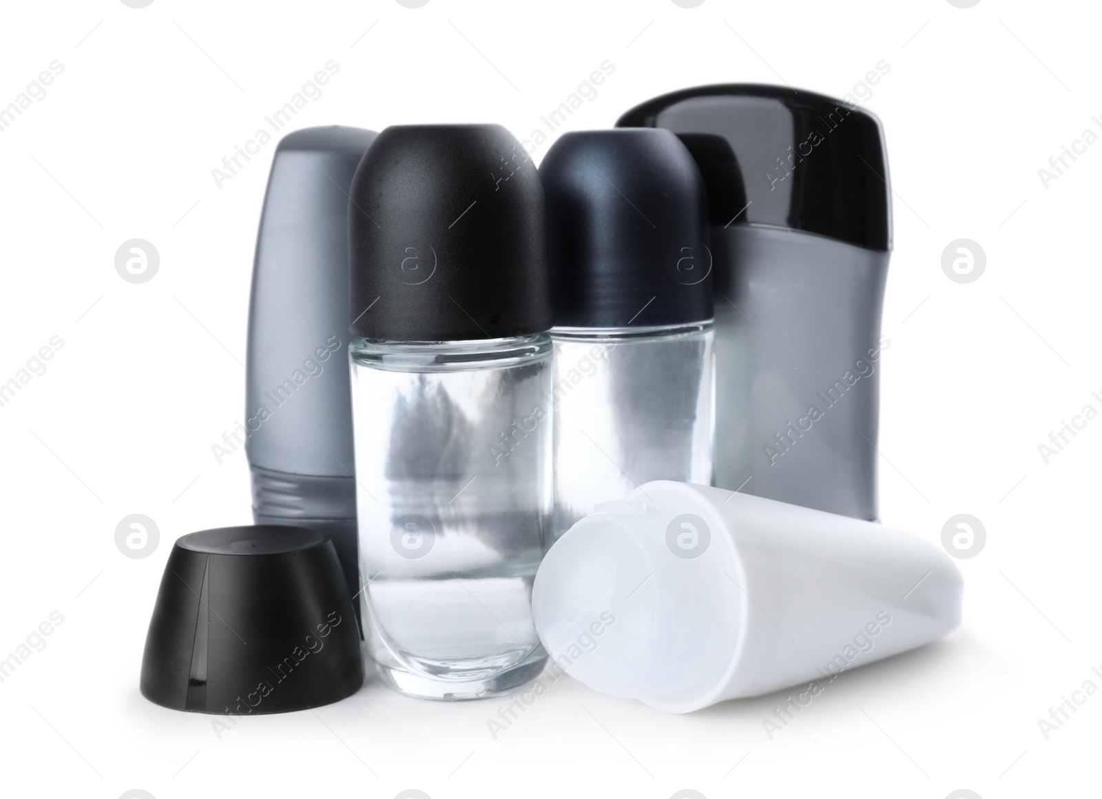 Photo of Different natural male deodorants on white background. Skin care