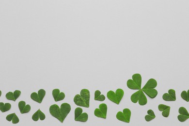 Photo of Composition with clover on white background, top view