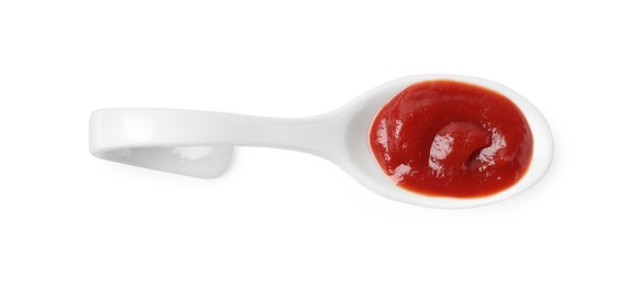 Ketchup in ceramic serving spoon isolated on white, top view