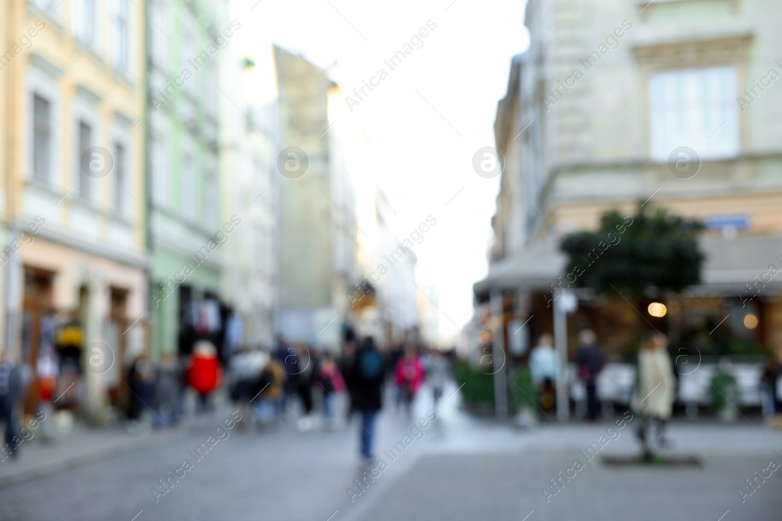 Photo of Blurred view of people walking on city street