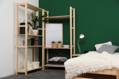 Wooden storage in stylish bedroom. Idea for interior design