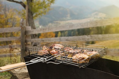 Cooking tasty meat on barbecue grill outdoors