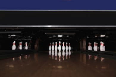 Photo of Bowling alley lanes with pins in club