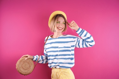 Photo of Beautiful young woman posing on color background. Summer fashion