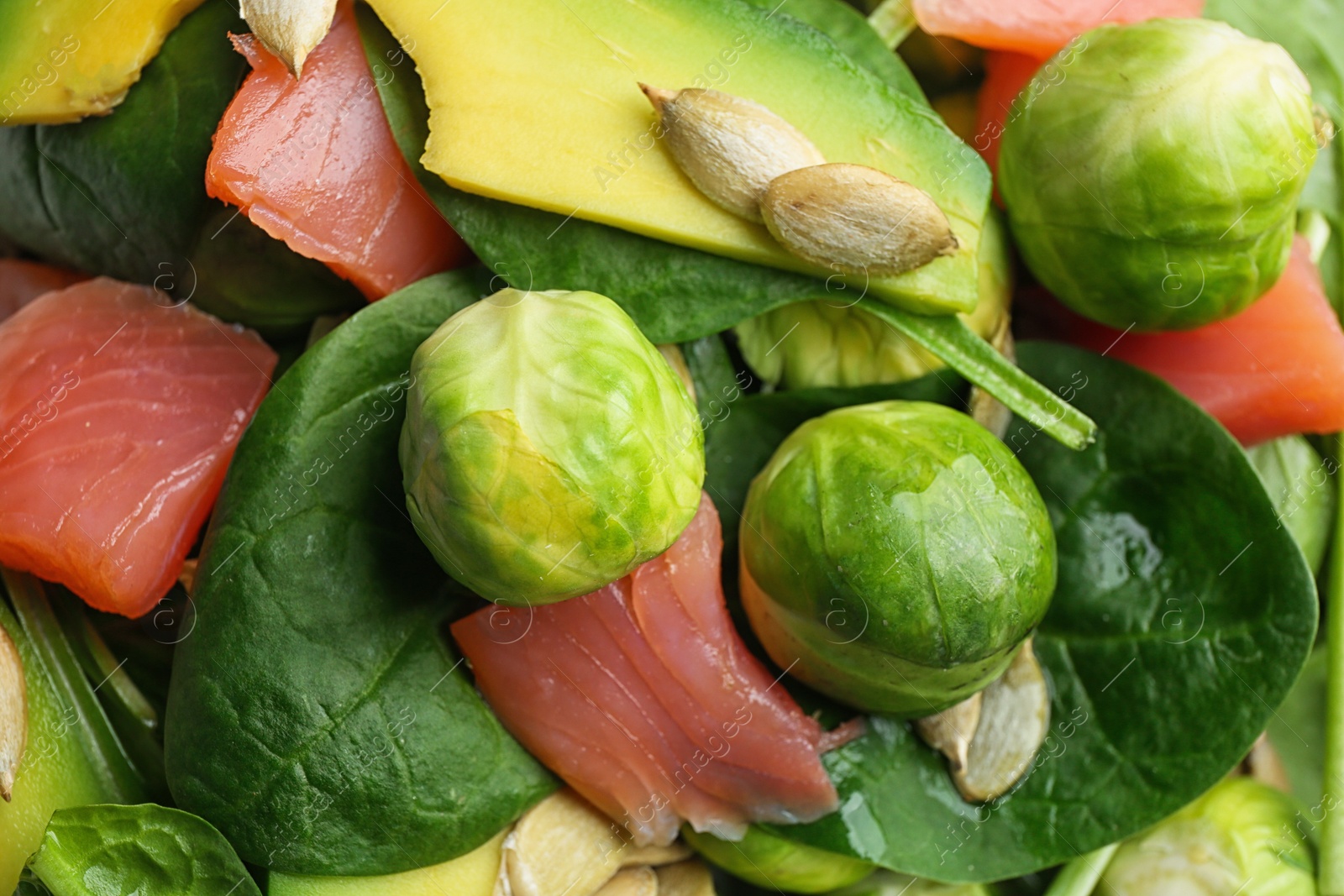 Photo of Tasty salad with Brussels sprouts as background, closeup