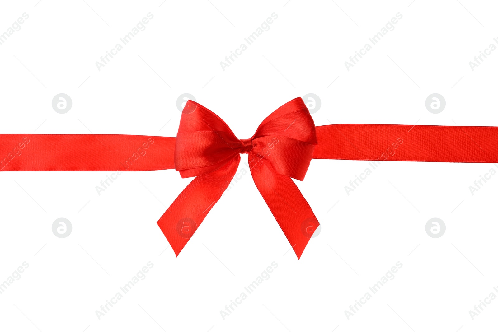 Photo of Red ribbon with bow on white background. Festive decoration