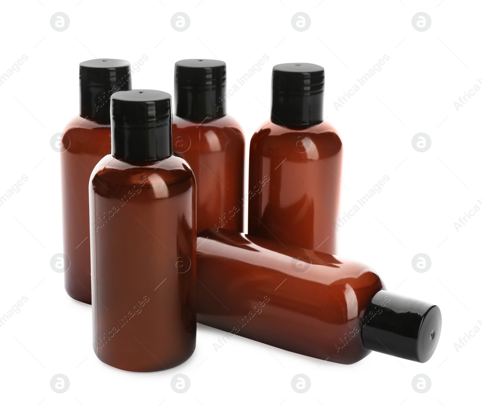 Photo of Mini bottles with cosmetic products on white background. Hotel amenities